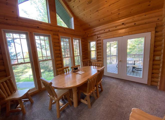 Dining area with access to the deck area and views of the lake.