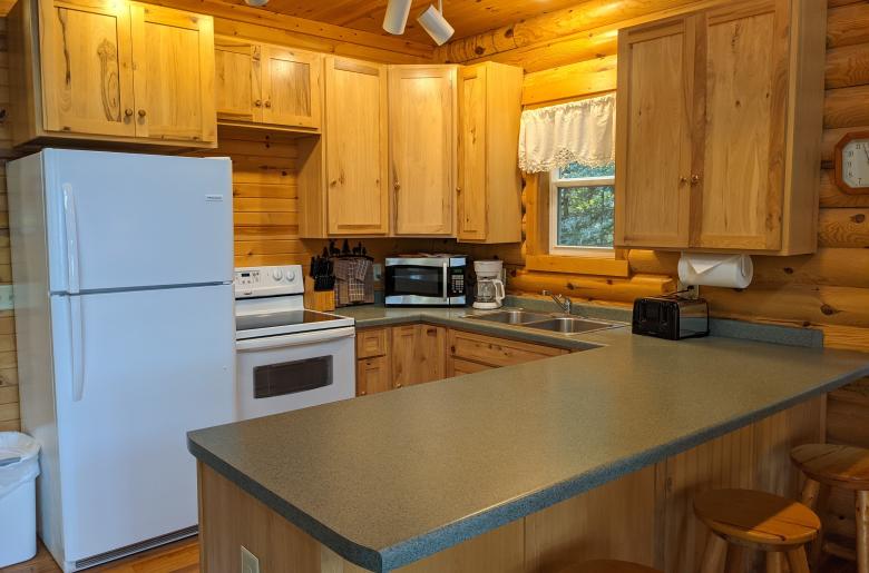 Kitchen with refrigerator, stove, and dishwasher.