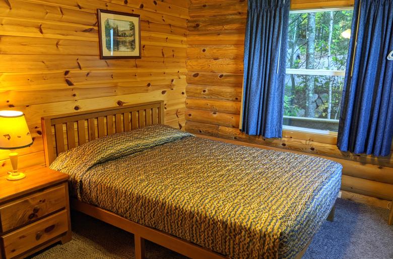 Main floor bedroom with a queen bed.