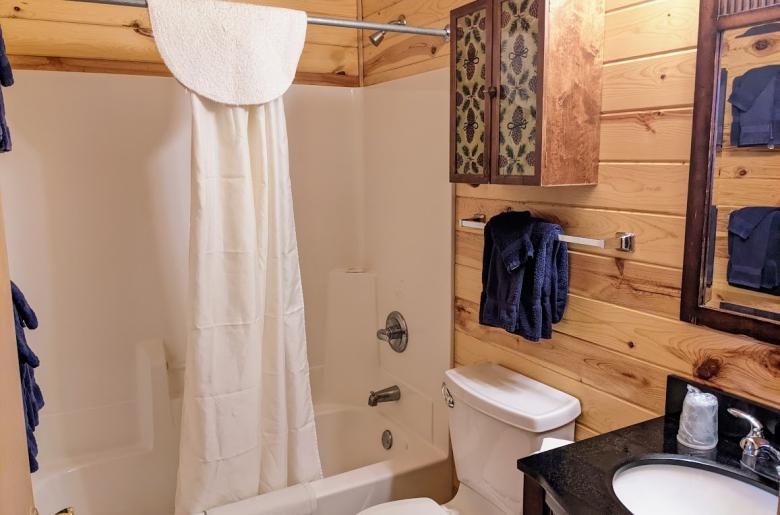 Upstairs bathroom with a standard tub/shower.