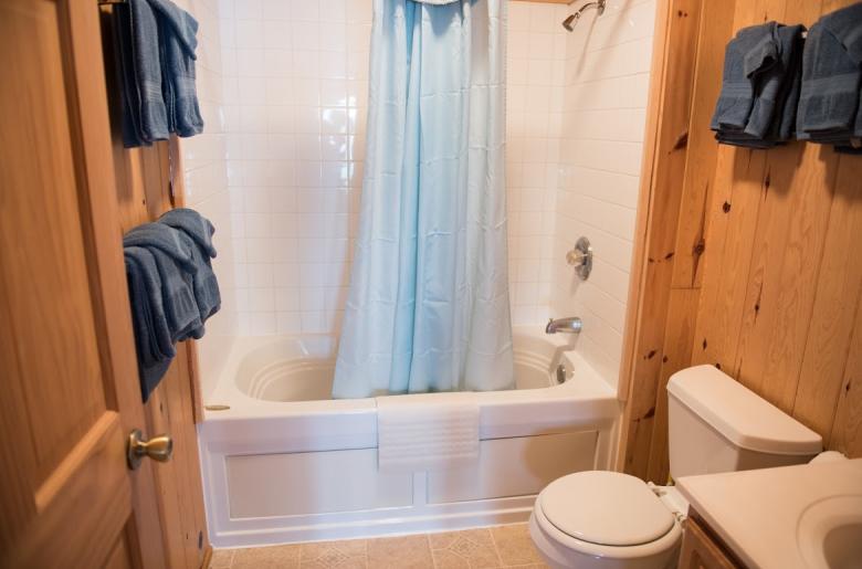 Upstairs bathroom with a standard tub/shower.