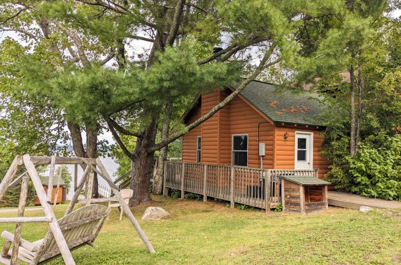 Exterior of Minnesota with firepit and swinging bench.