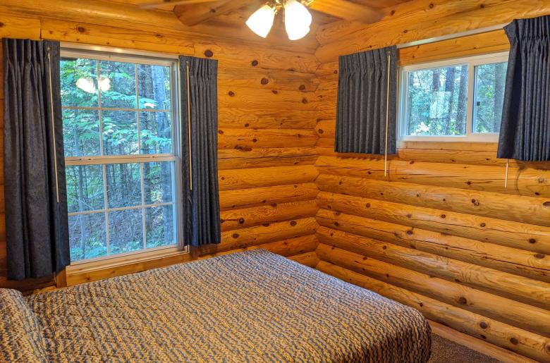 Main floor bedroom with a queen bed.