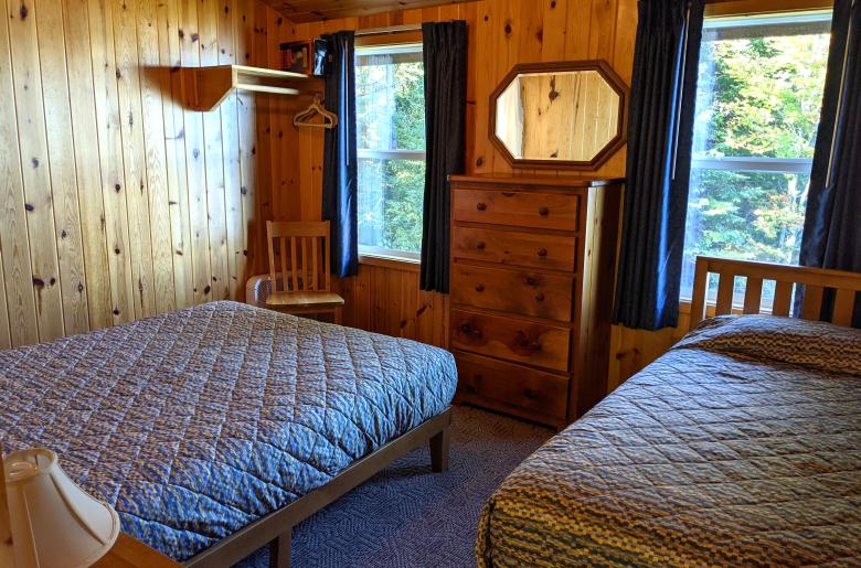 Upstairs bedroom with a queen and twin bed.