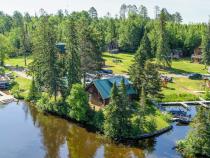 Aerial exterior of Lakeshore with water on two sides.