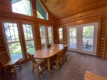 Dining area with access to the deck area and views of the lake.