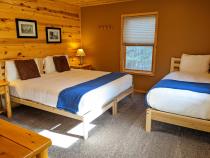 Master bedroom with a king, twin, and ensuite bathroom.