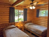 Main floor bedroom with two twin beds.