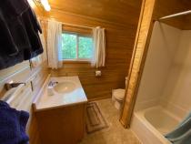 Upstairs bathroom with a standard tub/shower.